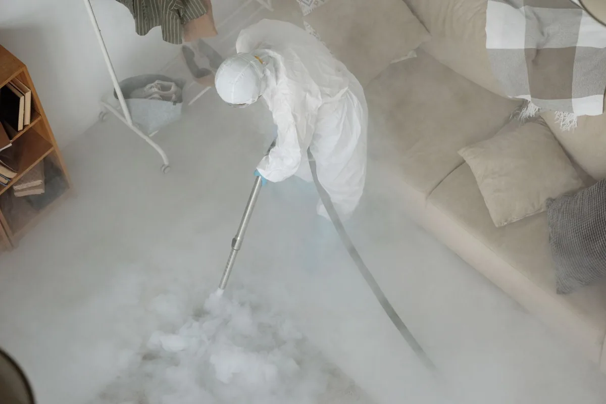 Biohazard cleanup technician in protective equipment, Groton, MA